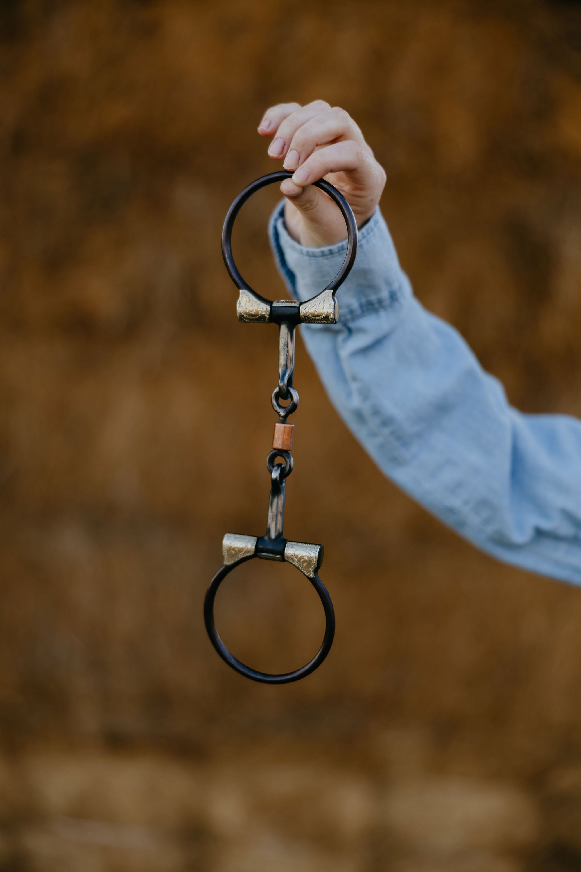 "California" Dogbone Roller Sweet Iron Dee Snaffle Bit w/Copper Inlay